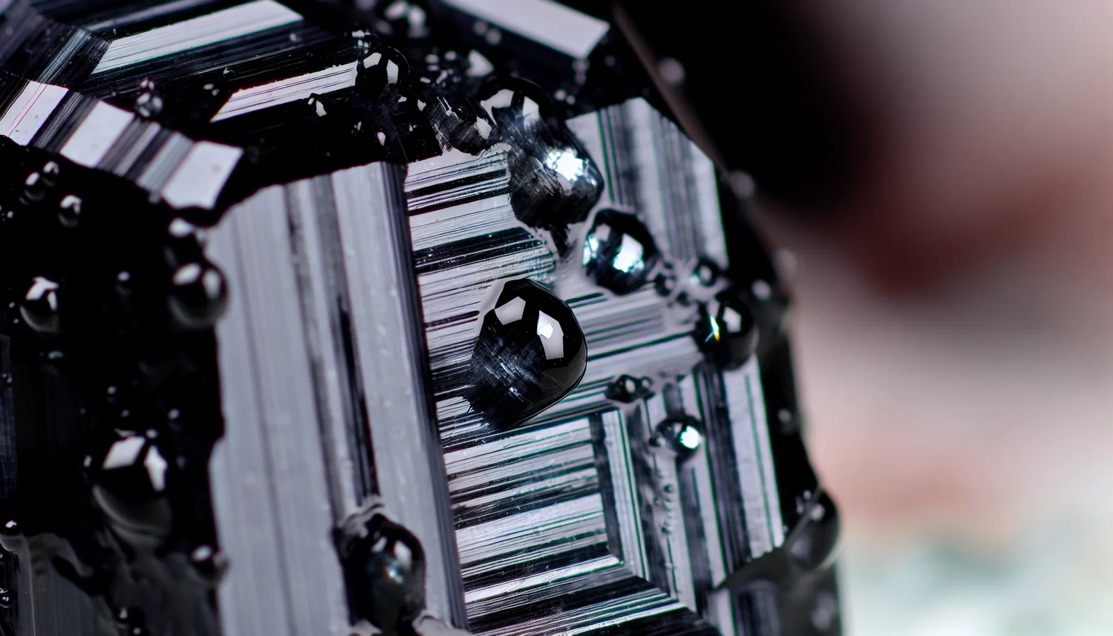 Black tourmaline crystal with water droplets